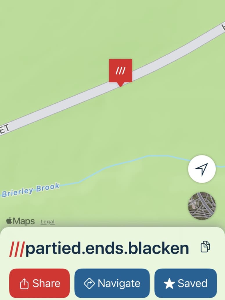 A map view displaying the location “///partied.ends.blacken” marked with a red pin.